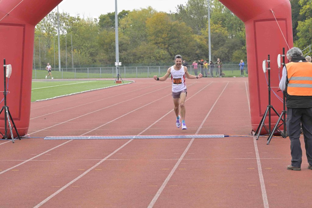 Crossing the line in first place at Abingdon Marathon 2025